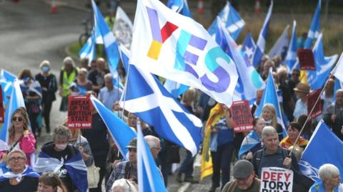 Pro-independence demonstrators stage a rally in Scottish capital Edinburgh on September 25, 2021