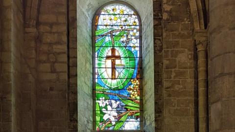 The stained glass in the window at Selby Abbey