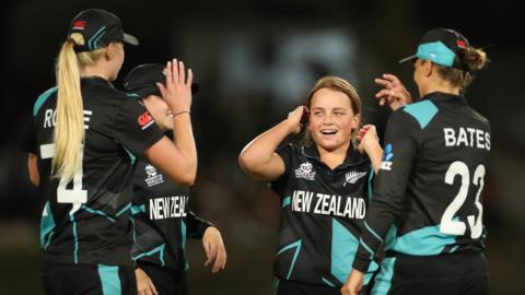 Eden Carson and New Zealand celebrate a wicket