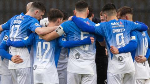 Haverfordwest County in a huddle before a game