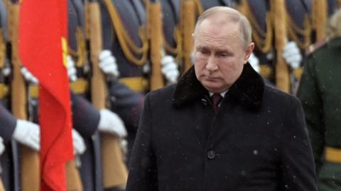 Russian President Vladimir Putin takes part in a wreath laying ceremony at the Tomb of the Unknown Soldier by the Kremlin Wall on the Defender of the Fatherland Day in Moscow, Russia February 23, 2022.