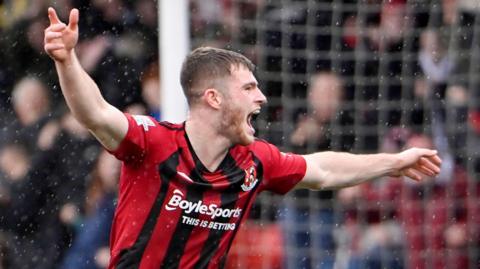 Kieran Offord celebrates a goal he scored for Crusaders during his loan spell at Seaview