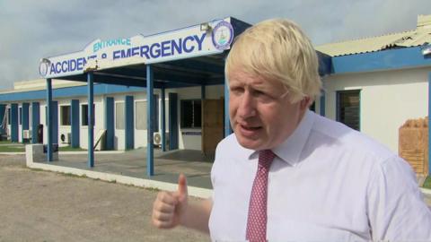 Boris Johnson outside a damaged hospital on the island of Anguilla