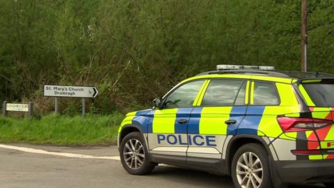 Police car outside the Loughmuck Road near Omagh