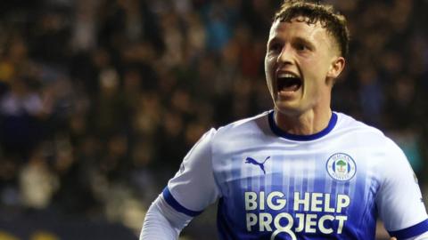 Nathan Broadhead celebrates scoring for Wigan against Blackburn.