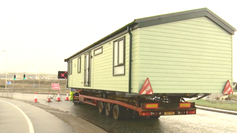 Lorry carrying house