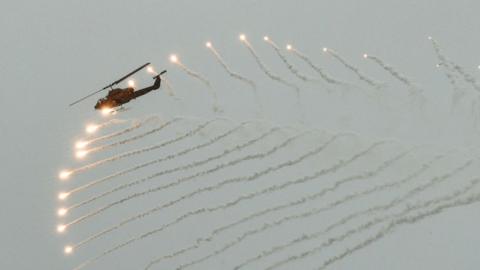 A US-made helicopter fires flares during a Taiwanese military exercise