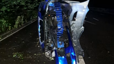 A blue crashed car