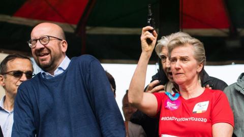 Belgian Prime Minister Charles Michel reacts as Princess Astrid of Belgium gives the start of the 38th edition of the Brussels' 20km run on May 28, 2017, in Brussels.