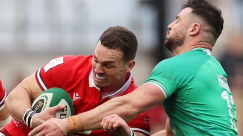 George North of Wales is tackled by Andrew Porter and Robbie Henshaw of Ireland