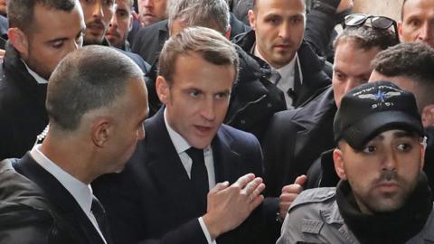 French President Emmanuel Macron confronts Israeli police at the entrance to the Church of St Anne in Jerusalem (22 January 2020)