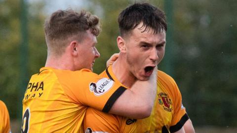 Annan's Max Kilsby celebrates after scoring to make it 2-1 during a cinch League One play-off final first leg match between Annan Athletic and Clyde at Galabank