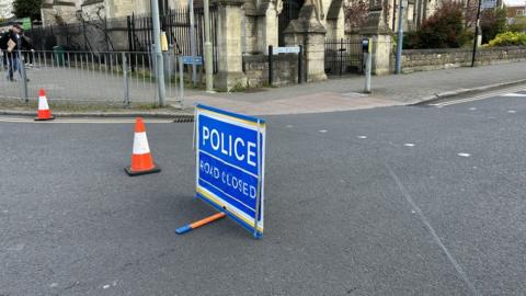 Police road closure sign