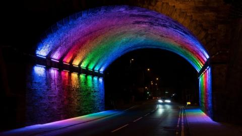 Archway Road railway bridge lit up in rainbow colours
