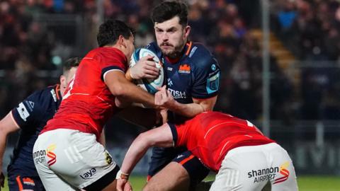 Edinburgh's Blair Kinghorn tries to get past the Munster defence during a BKT United Rugby Championship match between Edinburgh