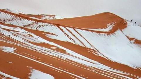 Snow is seen on the sand dunes of the Sahara