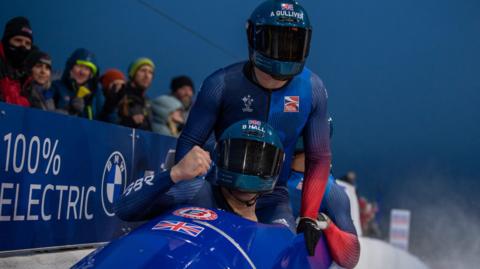 Brad Hall leads GB's four-man bobsleigh team in their sled on a track