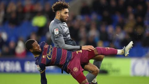 Kion Etete of Cardiff City is challenged by Kenneth Paal of Queens Park Rangers