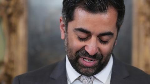 Humza Yousaf looks down as he resigns at Bute House on 29 April