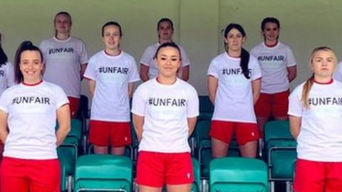 Players at Abergavenny wearing T-shirts bearing the word "unfair"