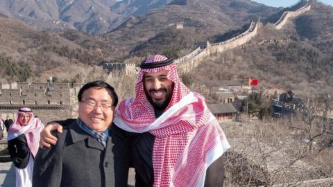 Saudi Arabia's Crown Prince Mohammed bin Salman poses for camera with the Chinese Ambassador to Saudi Arabia Li Huaxin during a visit to Great Wall of China in Beijing