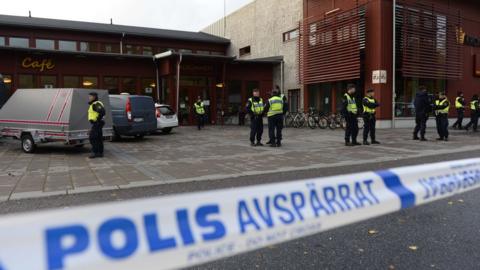 Police work at the scene of a primary and middle school in Trollhattan, southwestern Sweden