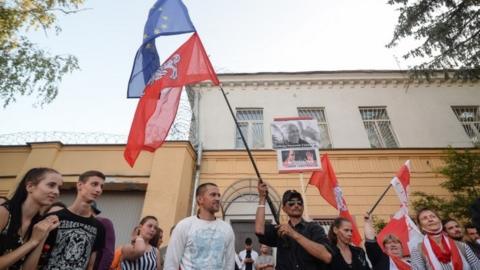Opposition supporters take part in a protest in front of the prison where Sergei Tikhanovsky is held in Minsk