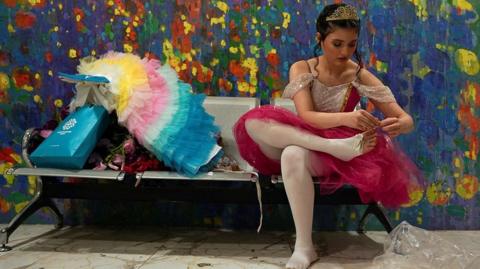 A ballerina prepares for her role