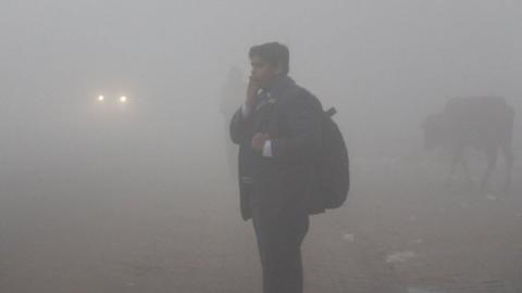 Students are seen wearing warm clothes to school amid dense fog on a cold winter morning, on December 30, 2019 in Gurugram, India.