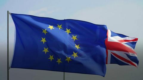 An EU flag and a UK union flag