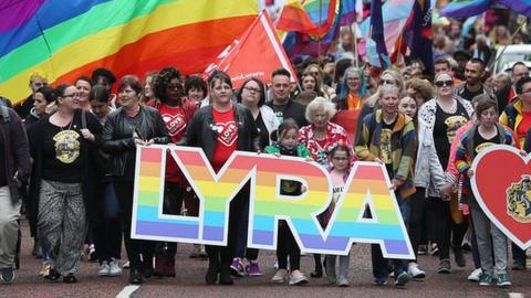 Sara Canning (front centre), partner of murdered journalist Lyra McKee, marching with protesters through Belfast city centre demanding same sex marriage in Northern Ireland.