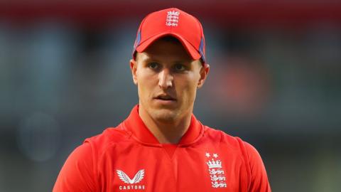 Brydon Carse in action for England in a T20 match against New Zealand in September