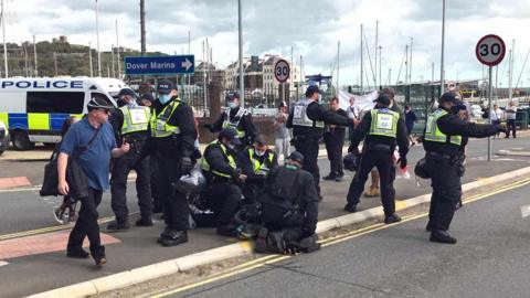 Police restrain protester