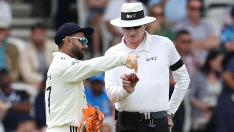 India wicketkeeper Rishabh Pant pleads his case to umpire Paul Reiffel about the condition of the ball on day three of the first Test
