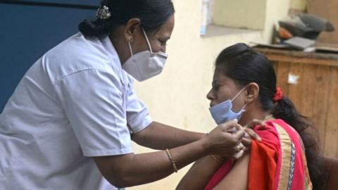 Woman gets a booster shot in Hyderabad, India