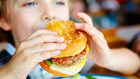 Child eating a burger