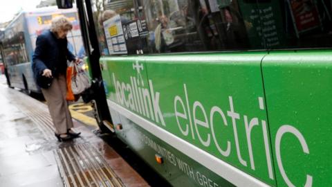 Passenger boards electric bus