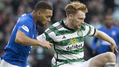 Rangers forward Cyriel Dessers and Celtic defender Liam Scales