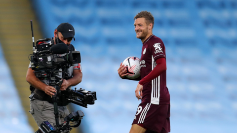 Jamie Vardy being filmed by a TV cameraman