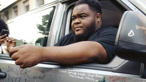 Micah Lammie sitting in car