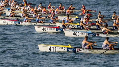 Men's eight rowers racing