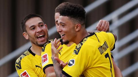 Jadon Sancho celebrates scoring