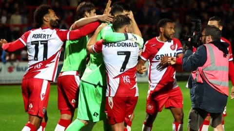 Stevenage players celebrate their win against Watford