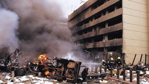 Firemen in action at the site of a huge bomb explosion that shook a bank building and US embassy in central Nairobi, Kenya, 07 August 1998