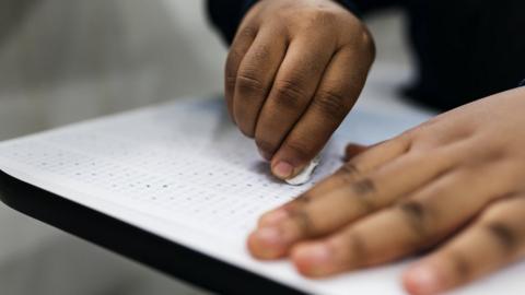 Stock photo of a Muslim student in class