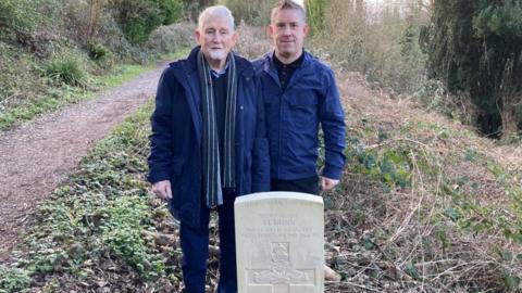 Reg and Andrew in front of Harry Dunn's grave