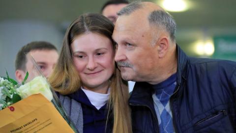 Maria Butina is welcomed by her father Valery Butin upon arrival at Sheremetyevo International Airport outside Moscow