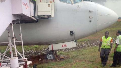 Airport Security officials check the tyres of the IX384 Air India Express Dubai to Mangalore