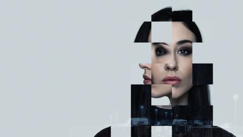 Pixellated image of a woman with dark hair looking straight at the camera