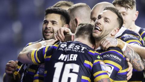 Leeds Rhinos players celebrate a try